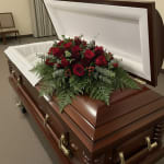 Red rose and flowers casket spray