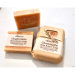 Set of three chamomile shea butter soap bars, one wrapped and two unwrapped on a light surface