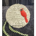 Decorative memorial plaque with a red cardinal and floral relief