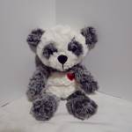 Plush panda bear with a red heart on its chest