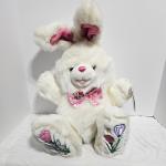 White plush bunny with pink accents and floral embroidery