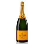 Bottle of champagne with gold foil top and bright yellow label