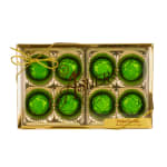 Gold box of eight green-foiled chocolate truffles tied with gold string