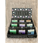 Display of FinchBerry handcrafted soap bars in black boxes