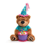 Plush brown birthday bear in a party hat holding a small stuffed cake with candles.