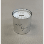 Silver glass candle with 'Love You' text on a neutral fabric surface