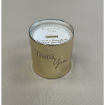 Tan glass jar candle with 'Thank You' text on a neutral surface