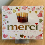 Box of Merci assorted chocolates with heart decorations