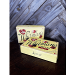 Two Whitman's Sampler chocolate boxes on a dark wooden surface