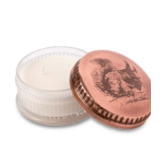 Two round candles in clear and copper-toned tins