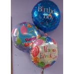 Three birthday balloons, including one for a boy and two with birthday messages