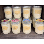Assorted scented candles in glass jars with metal lids