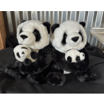 Two plush panda bears holding smaller panda toys.