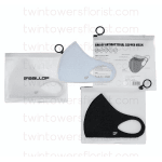 Three packaged face masks in white, light blue, and black