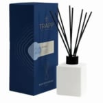 Blue boxed reed diffuser with white bottle and black reeds