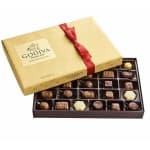 Box of assorted chocolates with a red ribbon