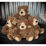Pile of brown teddy bears with cream faces and paws
