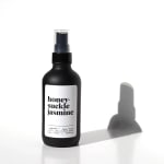 Black honeysuckle jasmine room spray bottle with white label on white background