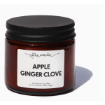 Amber glass jar candle with black lid and Apple Ginger Clove label