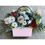 Mixed bouquet of roses and daisies in a pink handled box