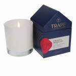 Lit white candle beside a navy fragrance box