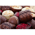 Assorted chocolate truffles with drizzled and sprinkled toppings