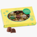 Box of assorted chocolate truffles with one cut open