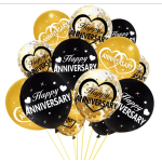 Cluster of black, gold, and clear anniversary balloons
