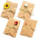Four kraft paper gift envelopes decorated with small flowers and twine