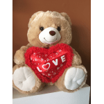 Teddy bear holding a red heart with the word LOVE