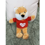 Plush fox wearing a red shirt with a heart that says Love