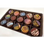 Box of assorted decorated chocolates in a tray