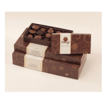 Stacked boxes of assorted chocolates with one open tray