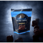 Bag of dark chocolate sea salt truffles with pieces scattered around it