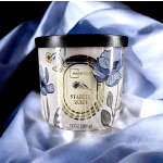 Floral-scented candle in a glass jar with a black lid