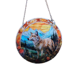 Round hanging suncatcher with a wolf and mountain scene