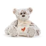 Plush teddy bear with a tag and ribbon