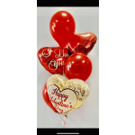 Cluster of red and heart-shaped Valentine balloons with printed messages