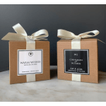 Two boxed candles tied with cream ribbons