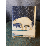 Polar bear illustration on a greeting card with a snowy night scene