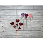 Glittery heart-shaped picks in red, purple, and pink on long stems