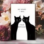 Birthday card with two black cats and floral background