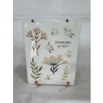 Floral-themed greeting card with "Thinking of you!" text in a clear display stand