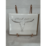A thank-you card with a longhorn skull illustration on a display stand.
