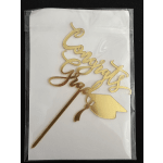 Gold "Congrats" cake topper on a white backing card
