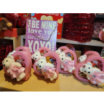Pink heart-shaped gift boxes with teddy bears and candy