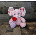 Pink plush elephant with heart-pattern ears holding a red fabric rose on a wooden surface