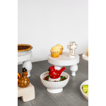 Decorative dessert display with cupcakes, pie, and ceramic bird figurines