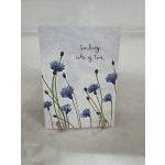Greeting card with blue flowers and the words "Sending lots of love"