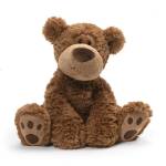 Brown plush teddy bear sitting on a white background